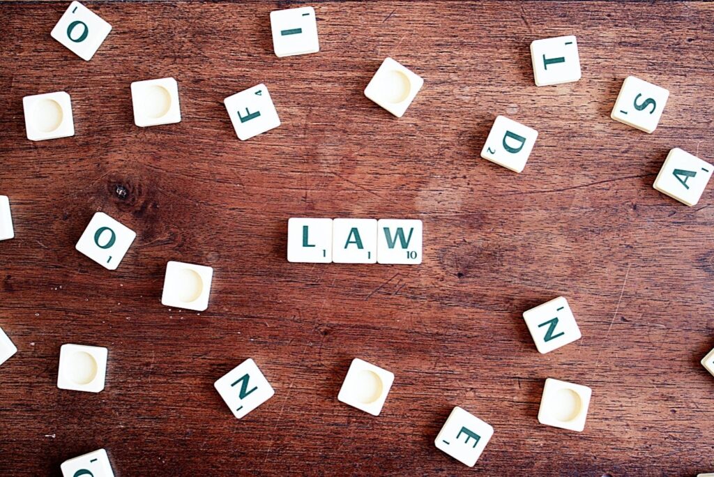 Scrabble tiles are joined to form the word law.